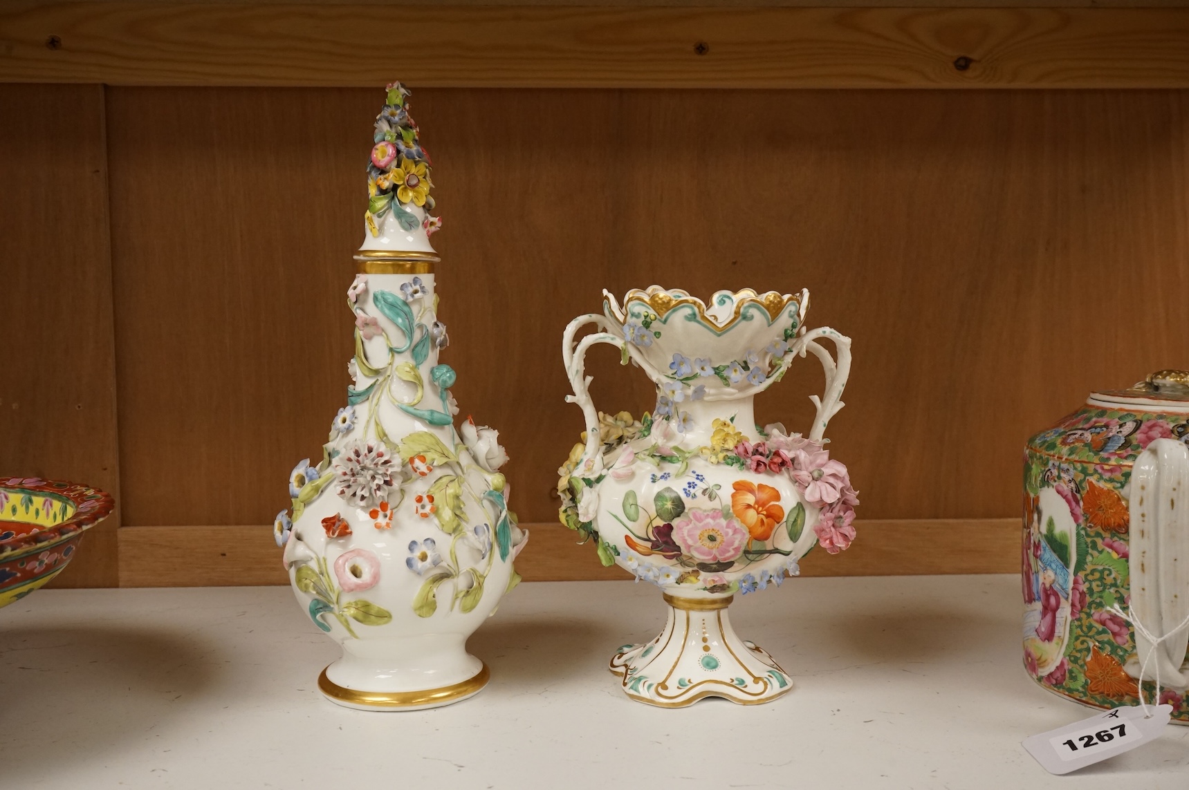 An English porcelain flower encrusted scent bottle and stoppers and a similar vase, c.1835, tallest 28cm